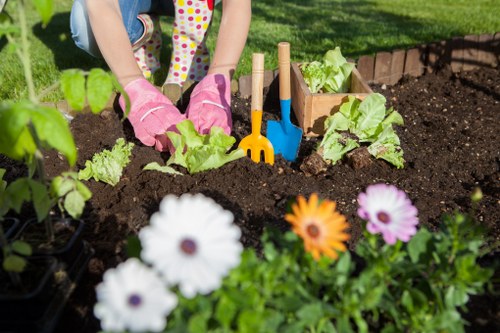 Training session for gardeners demonstrating machinery safety